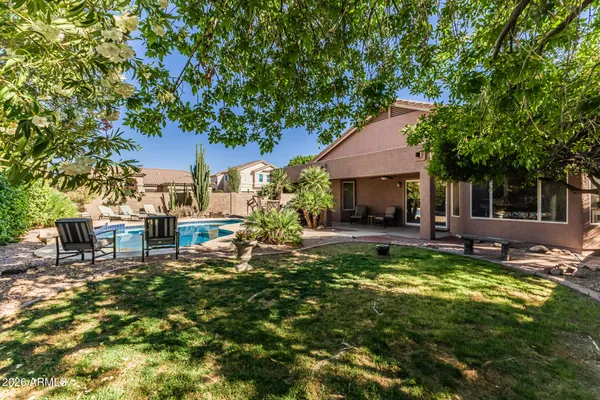 a view of a swimming pool with chairs