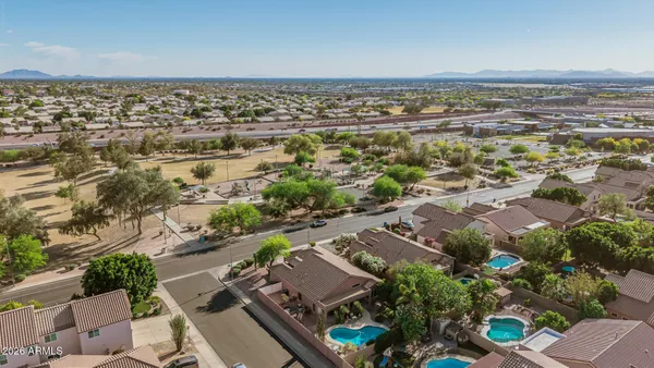 an aerial view of residential building and lake