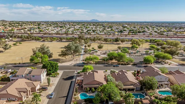 an aerial view of residential houses with outdoor space