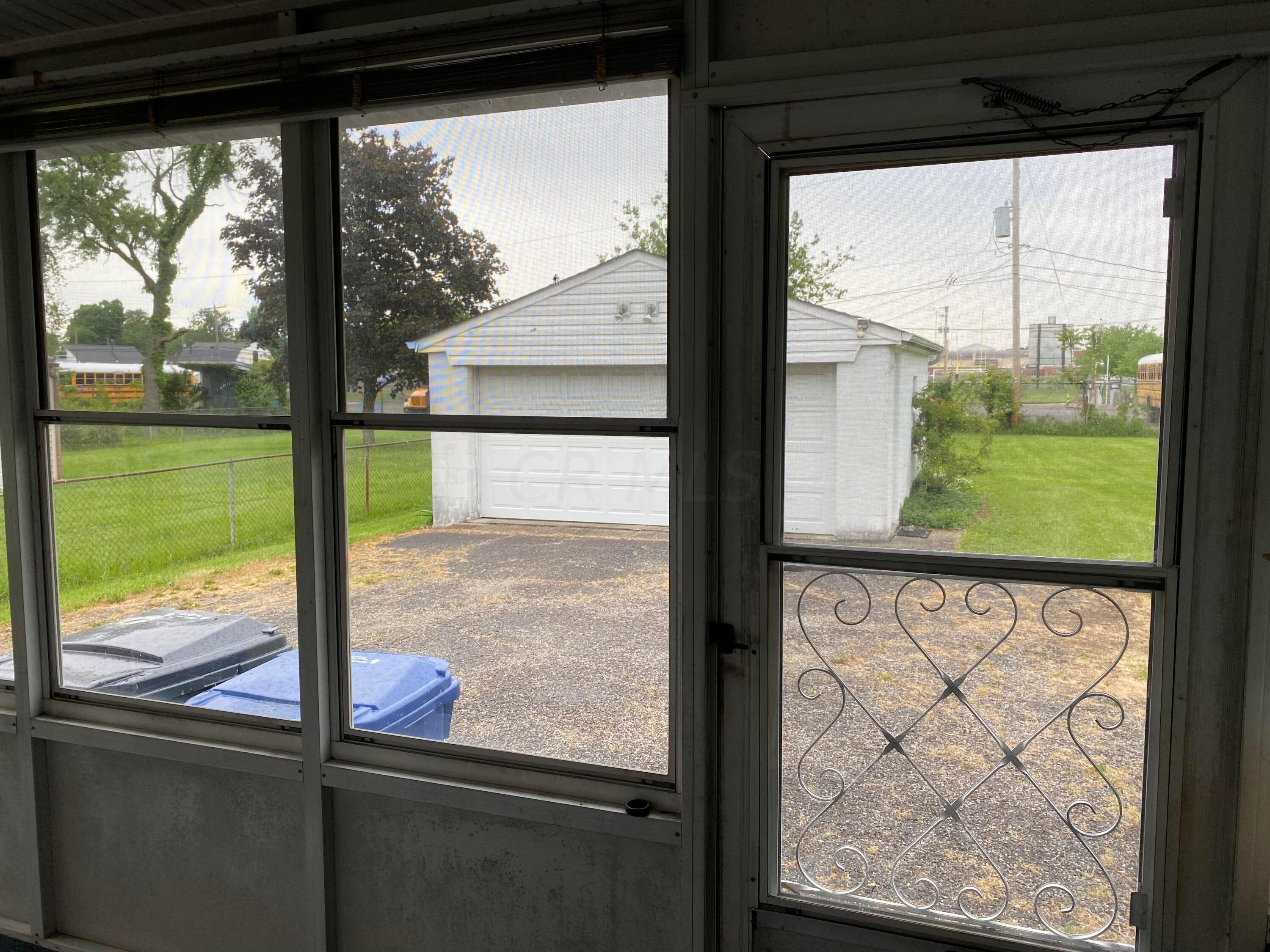 622 Beechwood Road Columbus, OH 43213 - Photo 19 of 24 Enclosed Patio door to back yard