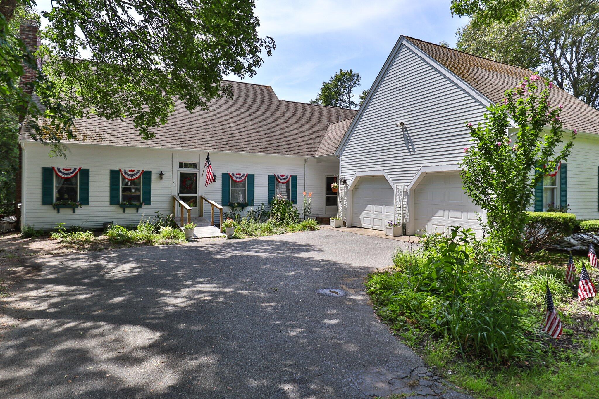 751 Main Street Harwich, MA 02645 - Photo 1 of 58 a front view of a house with garden