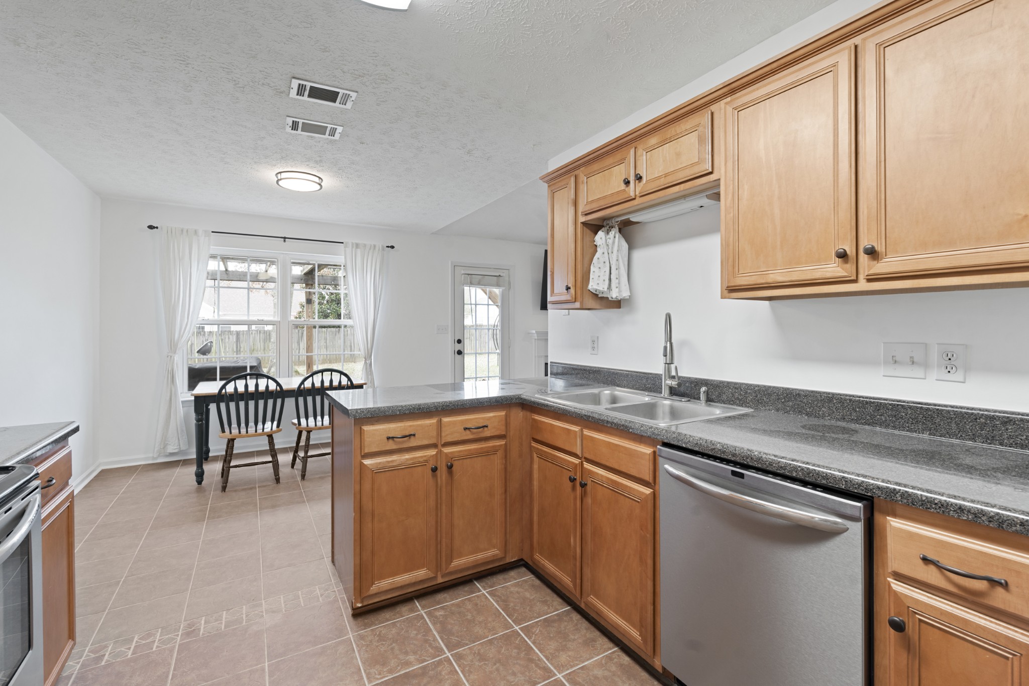2213 New Port Drive Spring Hill, TN 37174 - Photo 12 of 32 a kitchen with a sink and cabinets