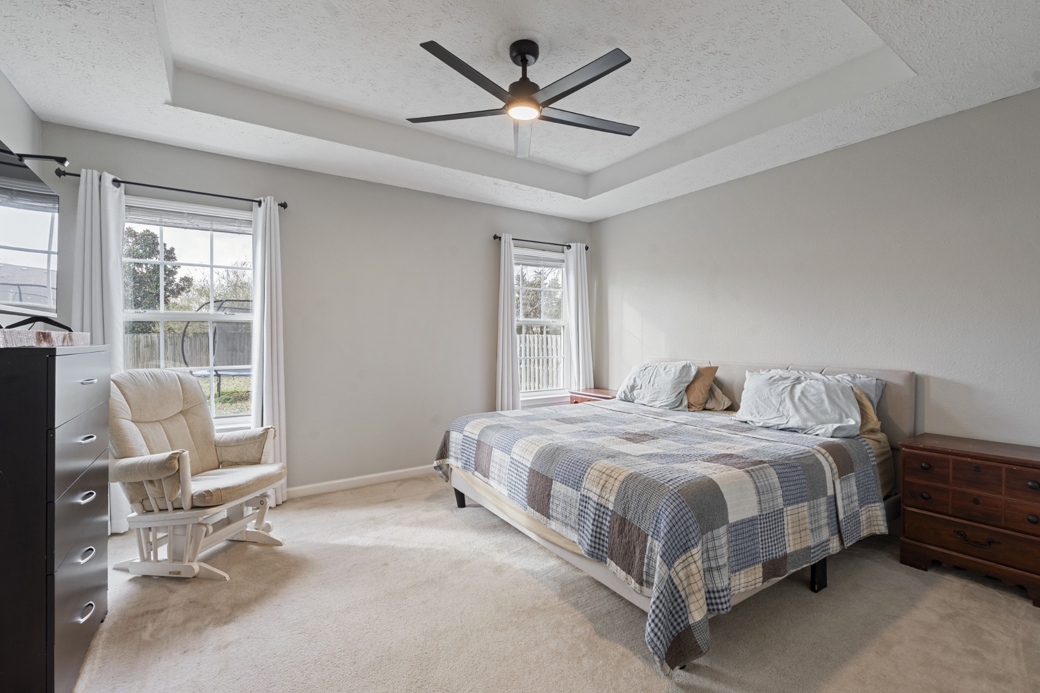 2213 New Port Drive Spring Hill, TN 37174 - Photo 13 of 32 a bedroom with a bed a chair and a large window
