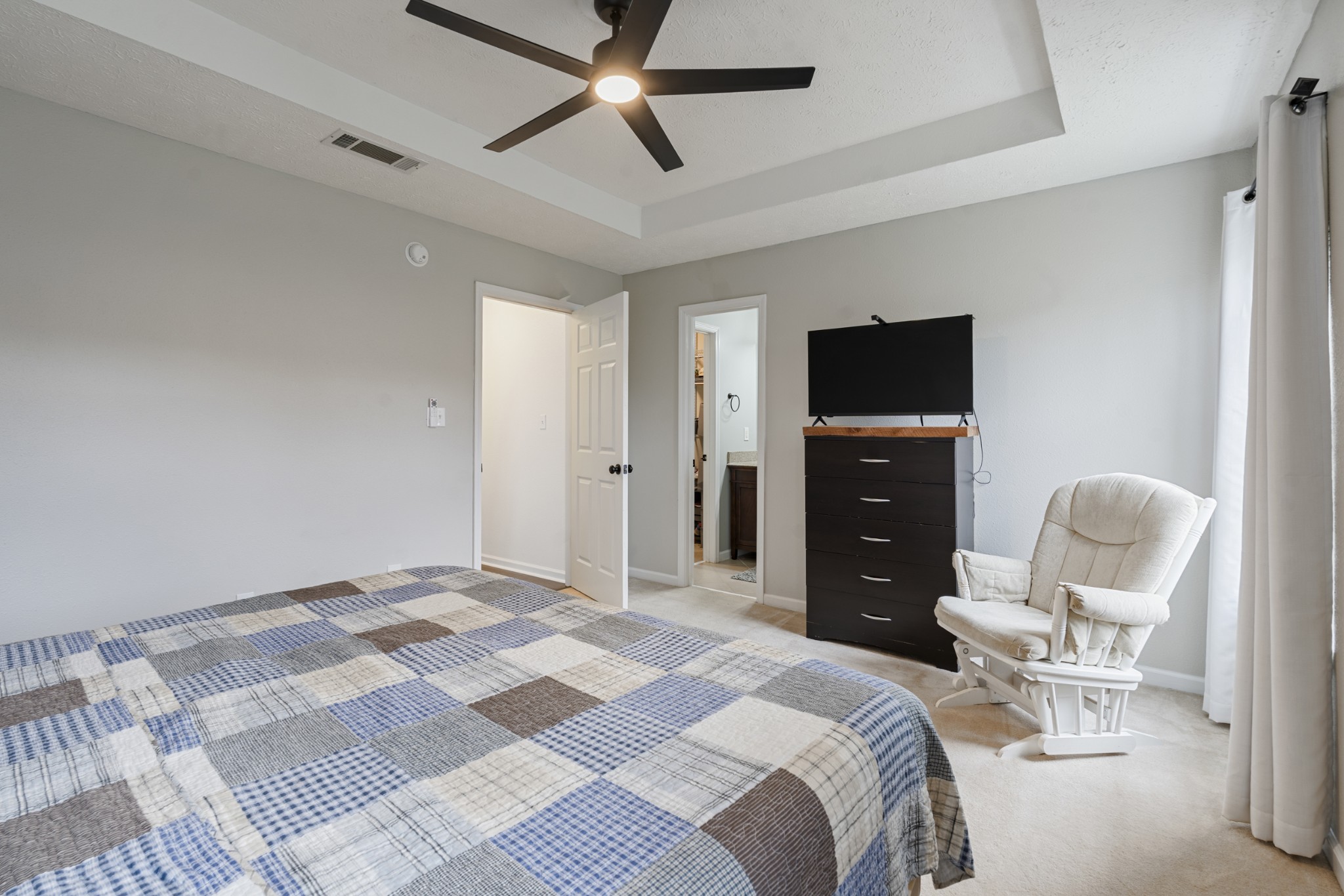 2213 New Port Drive Spring Hill, TN 37174 - Photo 14 of 32 a bedroom with a bed and chair
