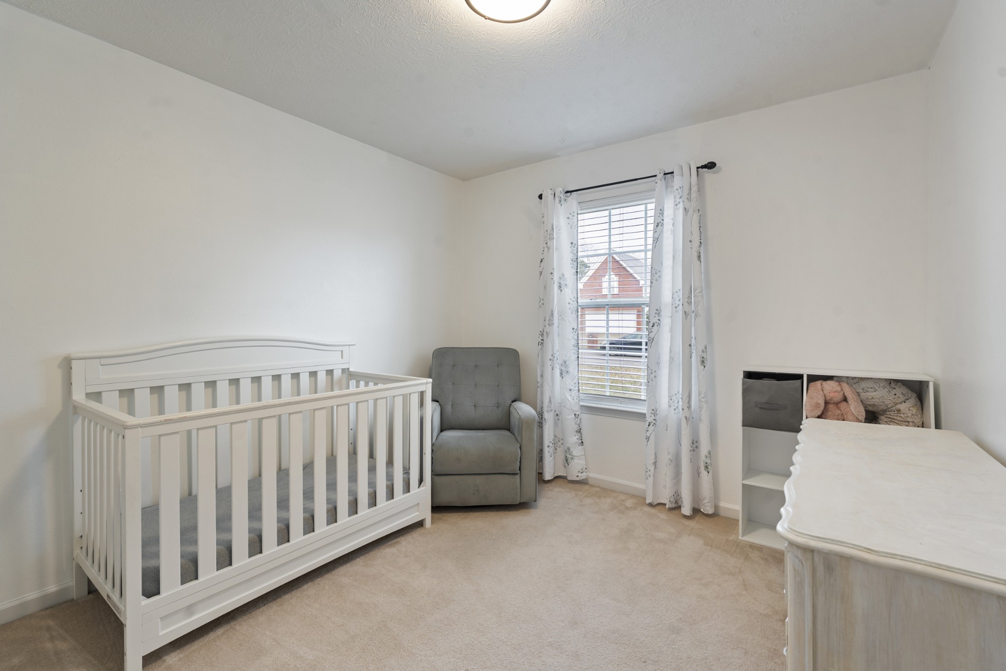 2213 New Port Drive Spring Hill, TN 37174 - Photo 17 of 32 a bedroom with a bed and wooden floor