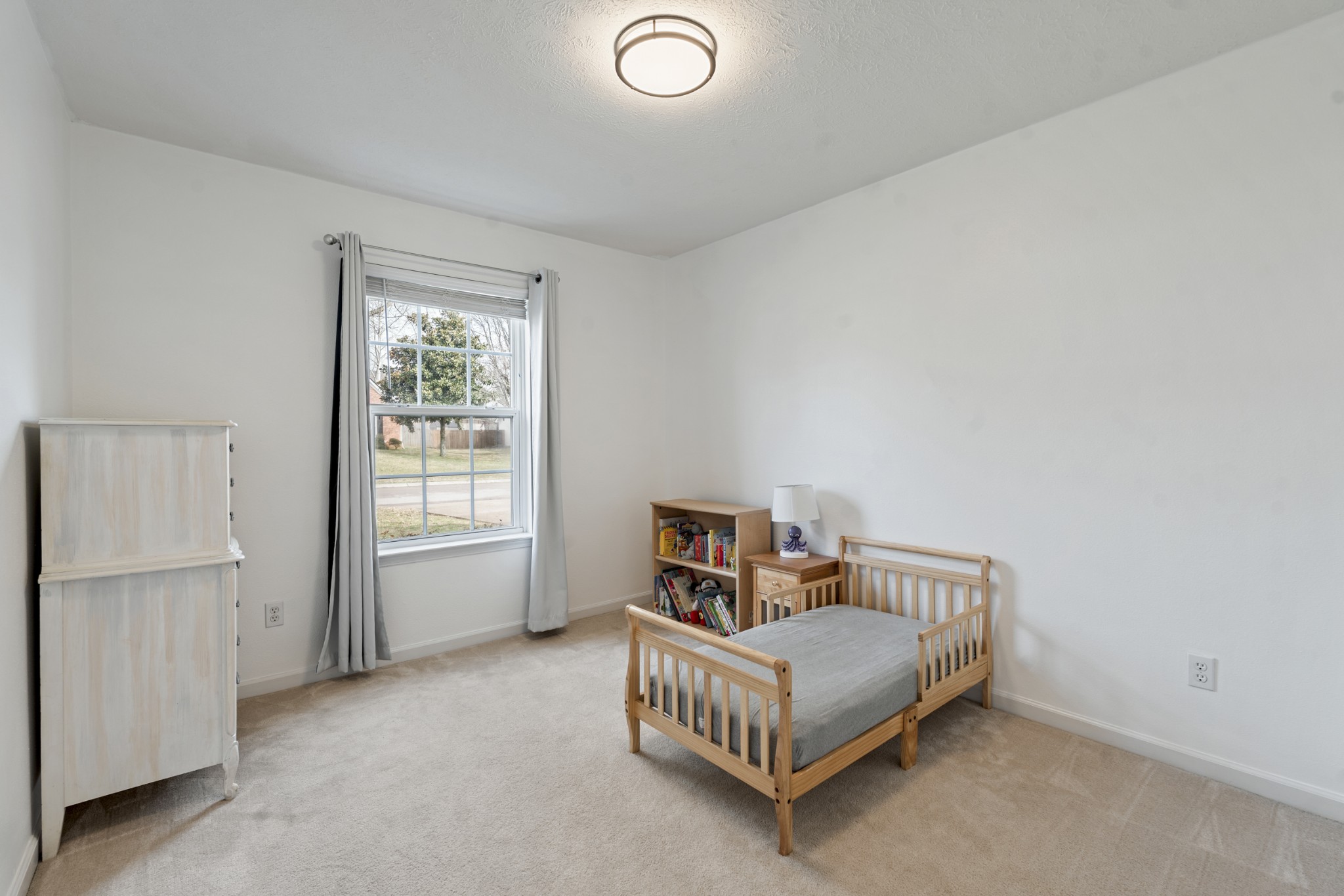 2213 New Port Drive Spring Hill, TN 37174 - Photo 18 of 32 a bedroom with a bed and a window