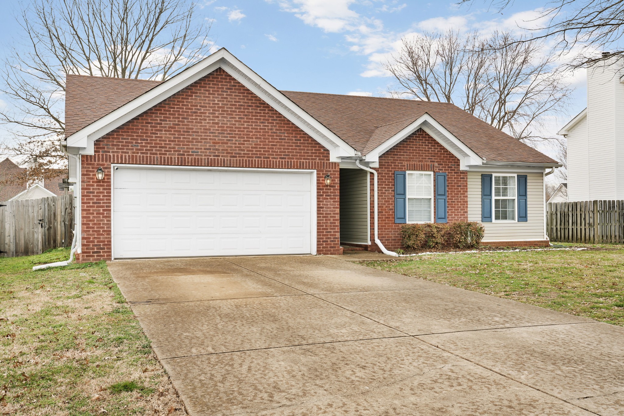 2213 New Port Drive Spring Hill, TN 37174 - Photo 2 of 32 a front view of a house with a yard and garage