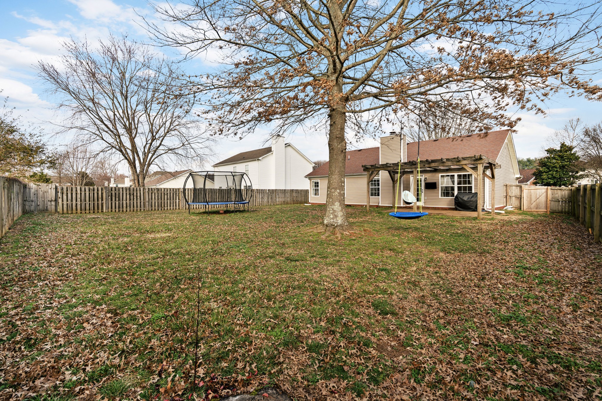 2213 New Port Drive Spring Hill, TN 37174 - Photo 25 of 32 a view of a yard with a large tree