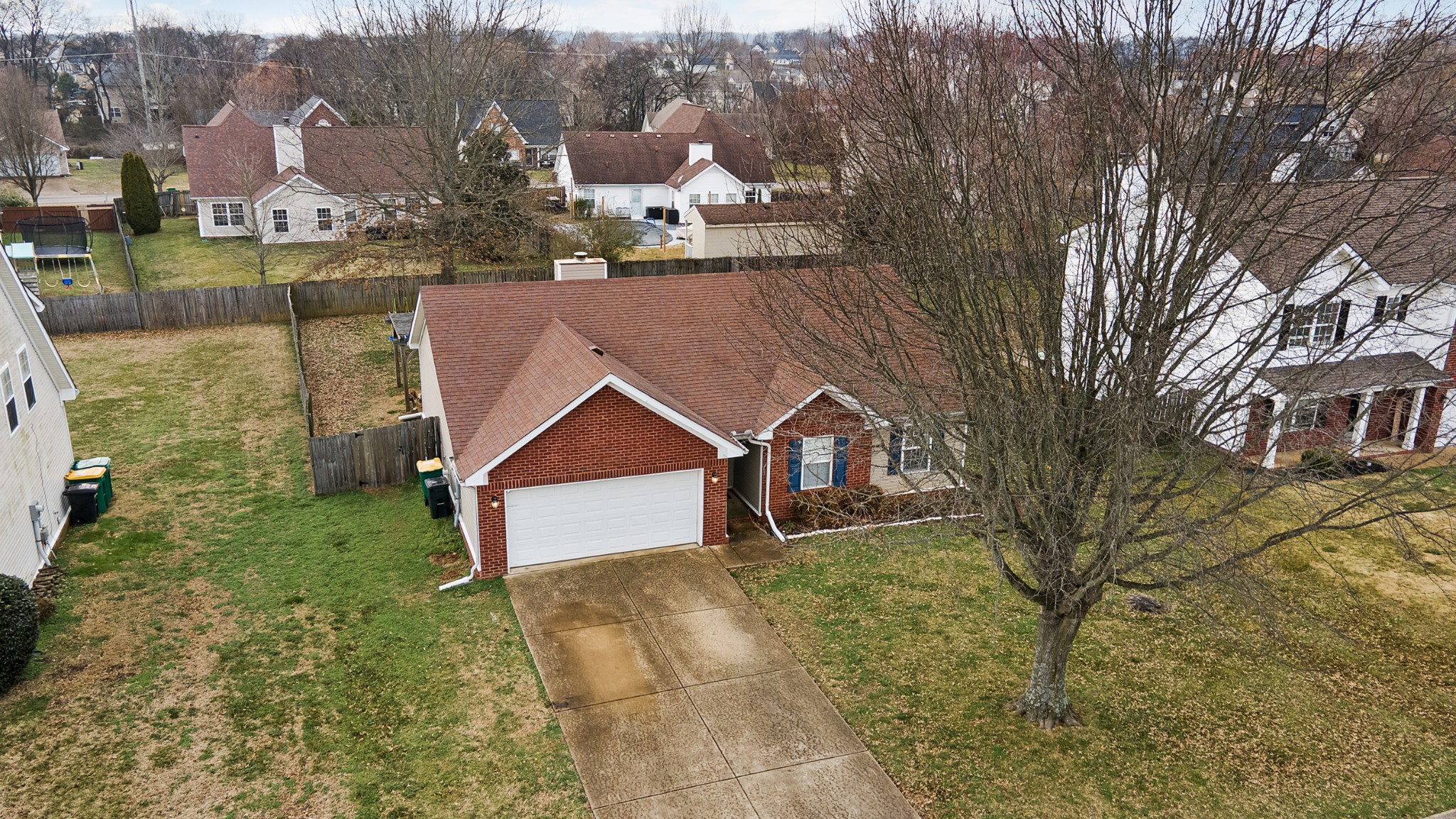 2213 New Port Drive Spring Hill, TN 37174 - Photo 27 of 32 a front view of a house with a yard and garage
