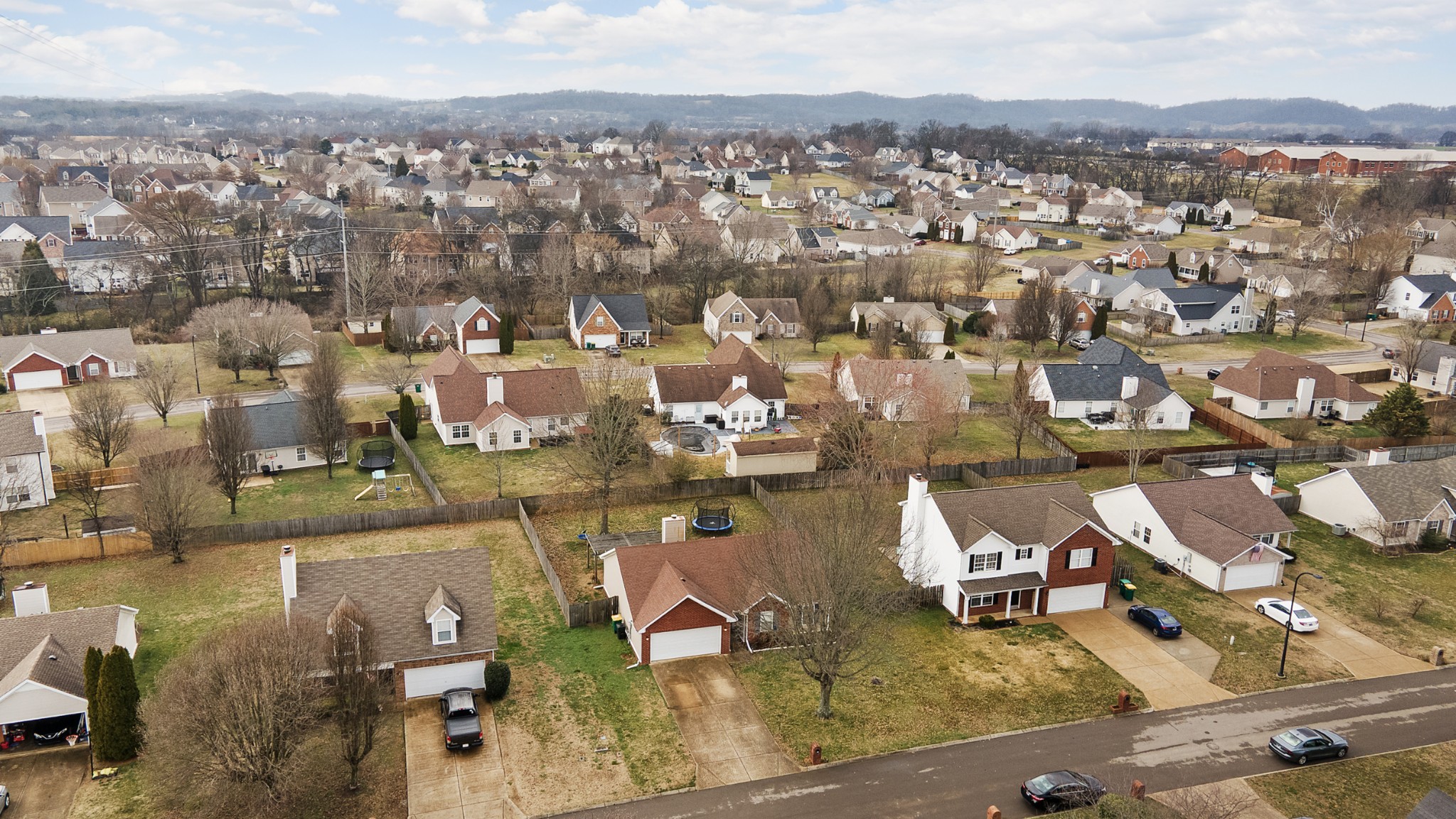 2213 New Port Drive Spring Hill, TN 37174 - Photo 28 of 32 an aerial view of a city with lots of residential buildings