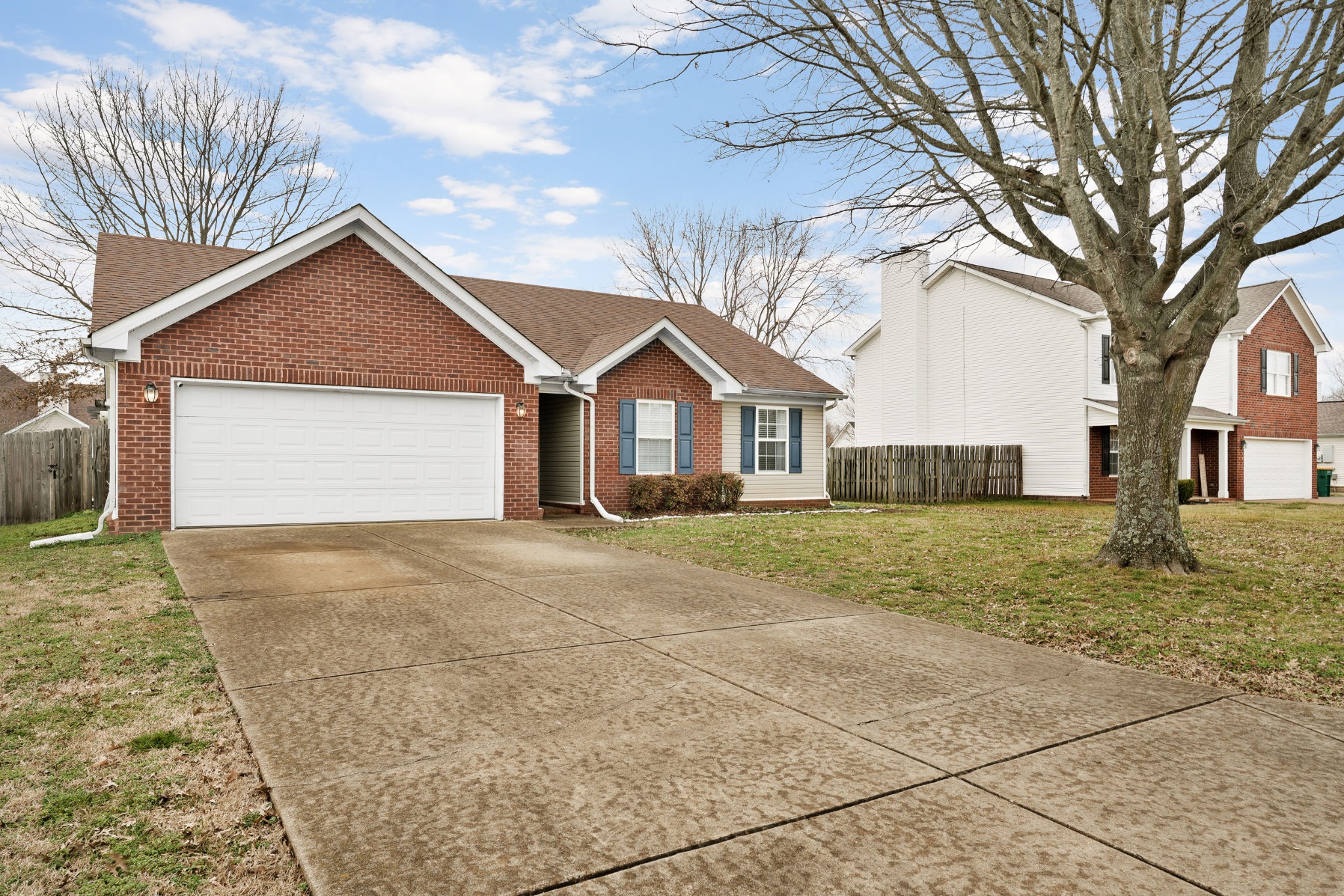 2213 New Port Drive Spring Hill, TN 37174 - Photo 3 of 32 a front view of a house with garden