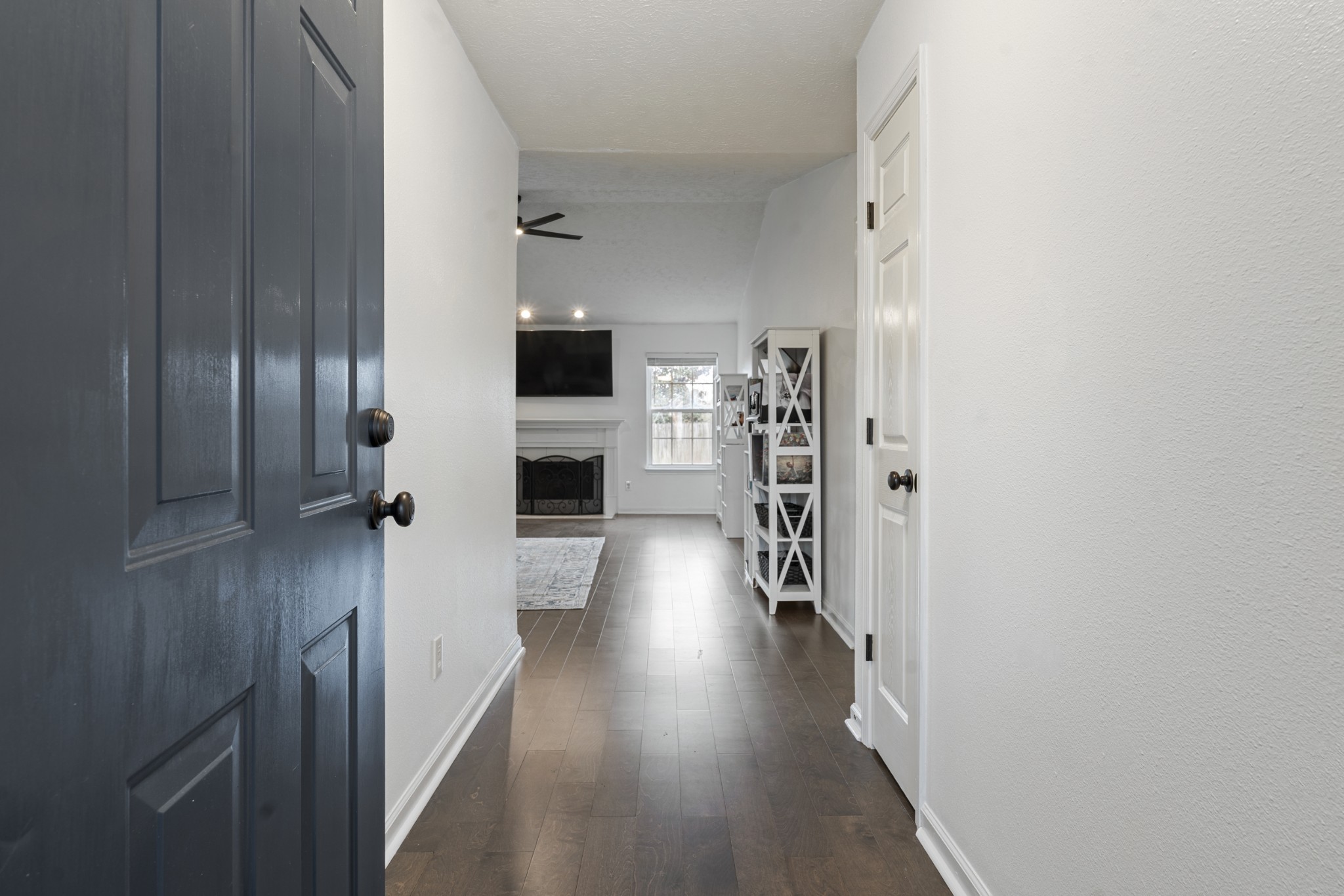 2213 New Port Drive Spring Hill, TN 37174 - Photo 4 of 32 a view of a hallway with wooden floor fireplace and windows