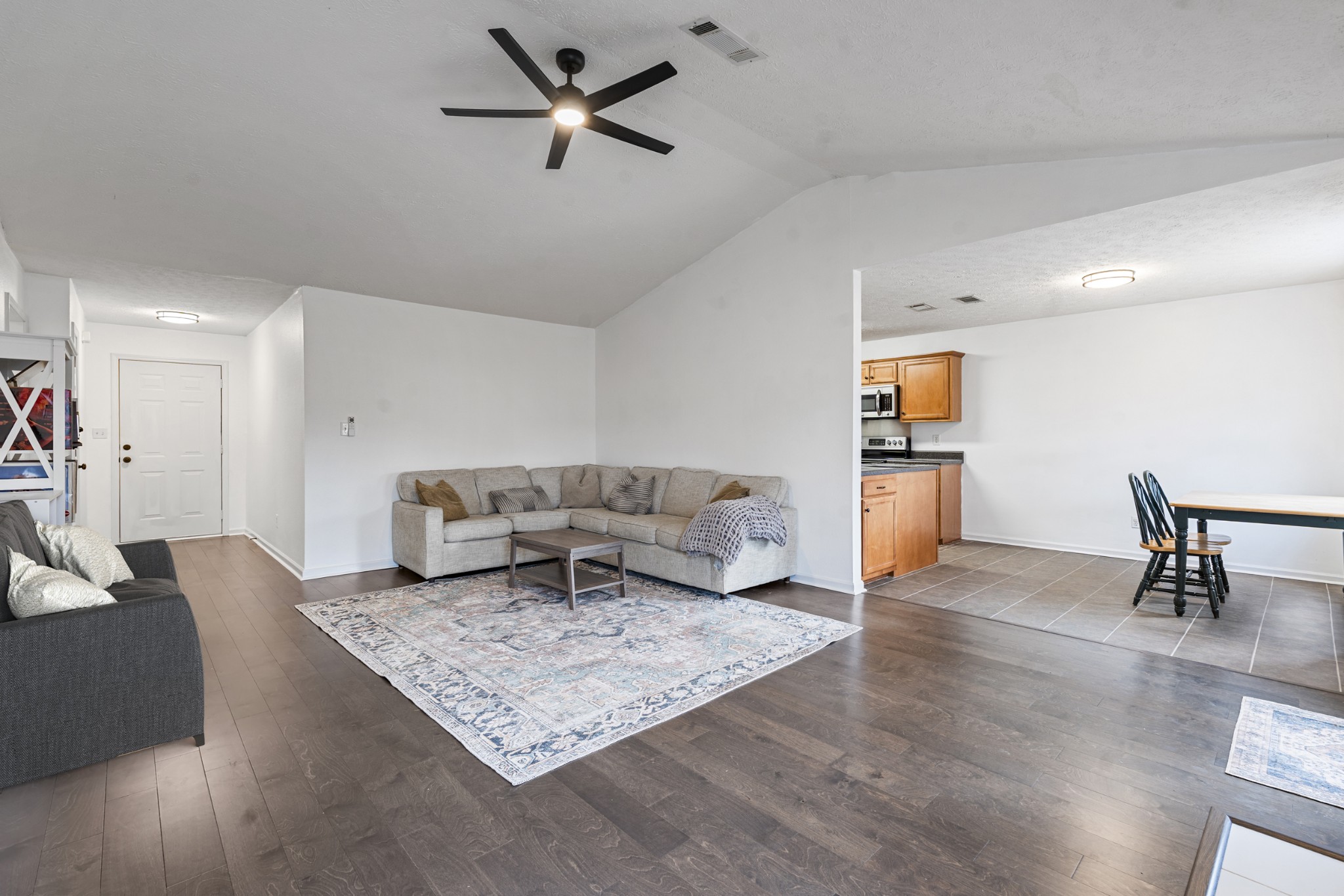 2213 New Port Drive Spring Hill, TN 37174 - Photo 6 of 32 a living room with furniture and a rug