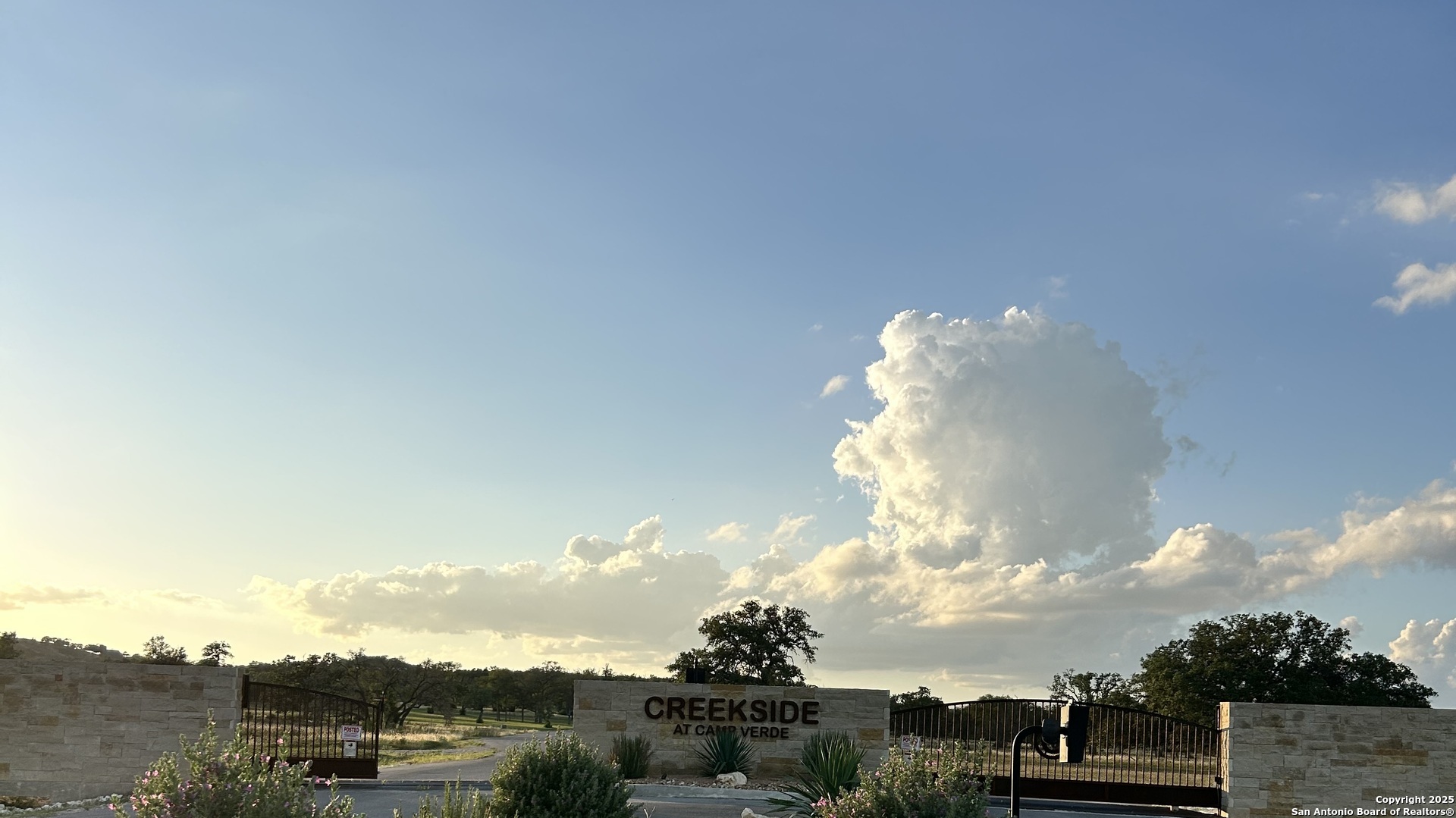 a view of a white building in front of house