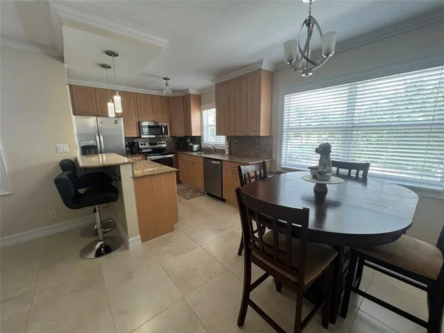 a view of a dining room with furniture