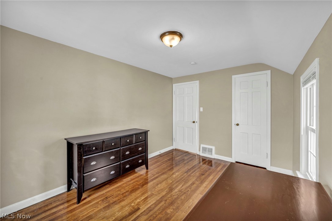 12821 Havana Road Cleveland, OH 44125 - Photo 26 of 41 Bedroom featuring lofted ceiling and hardwood / wood-style flooring