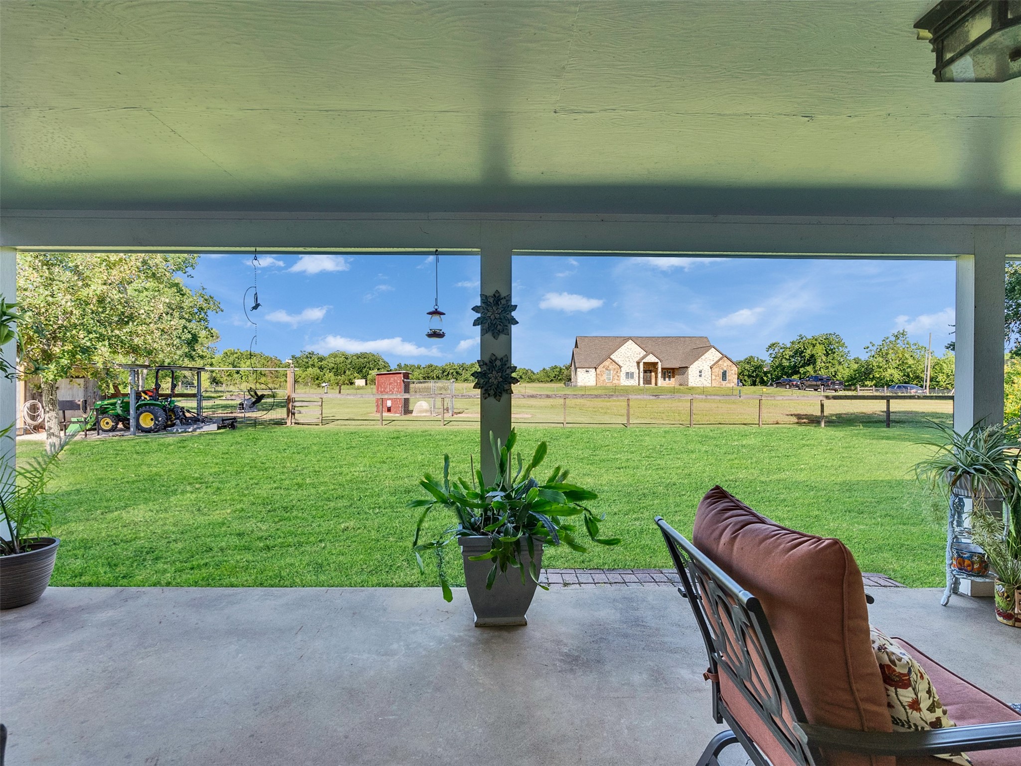 7202 Wetzel Road Dickinson, TX 77539 - Photo 32 of 46 This covered patio is the perfect place to relax and unwind while taking in peaceful views of the surrounding acreage.