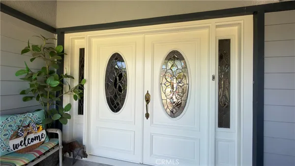 a view of a entryway door with wooden floor