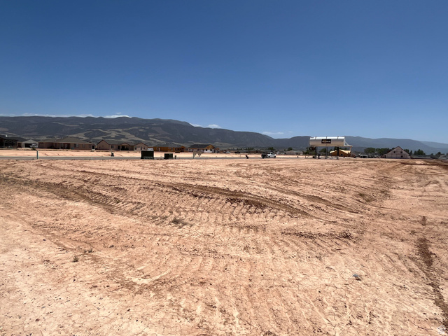 5183 North 75 East, Unit 213 Enoch, UT 84721 - Photo 4 of 12 Expansive cleared lot with visible tire tracks