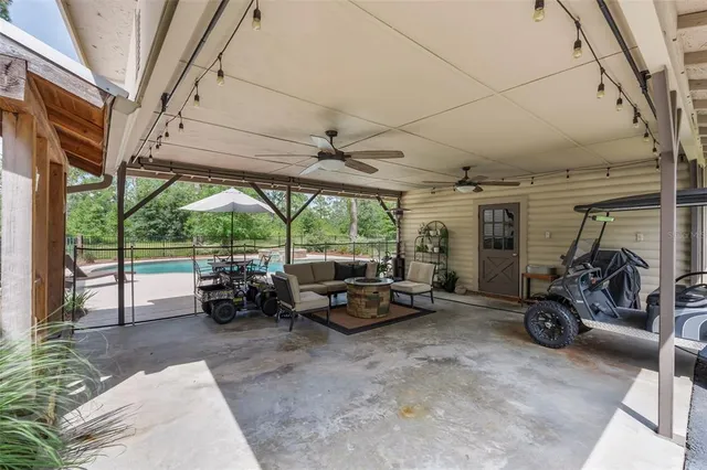 a living room with fireplace furniture and a flat screen tv