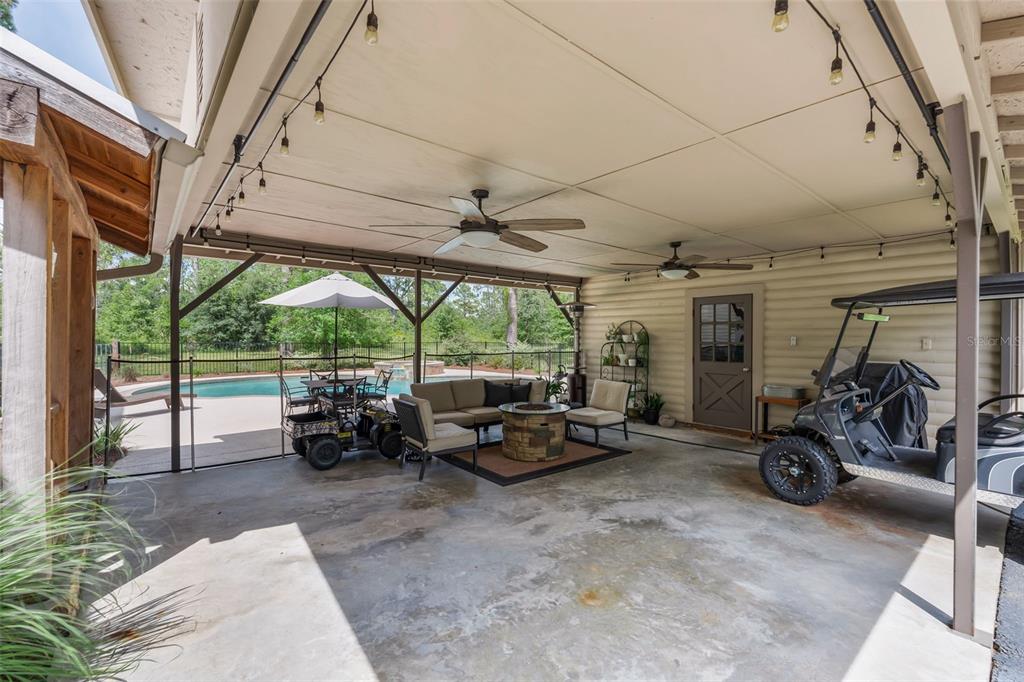 3771 184th Street Wellborn, FL 32094 - Photo 12 of 74 a living room with patio furniture and a large window