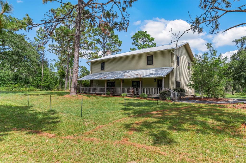 3771 184th Street Wellborn, FL 32094 - Photo 2 of 74 a view of a house with a big yard