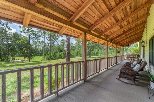 a front view of house with yard and trees