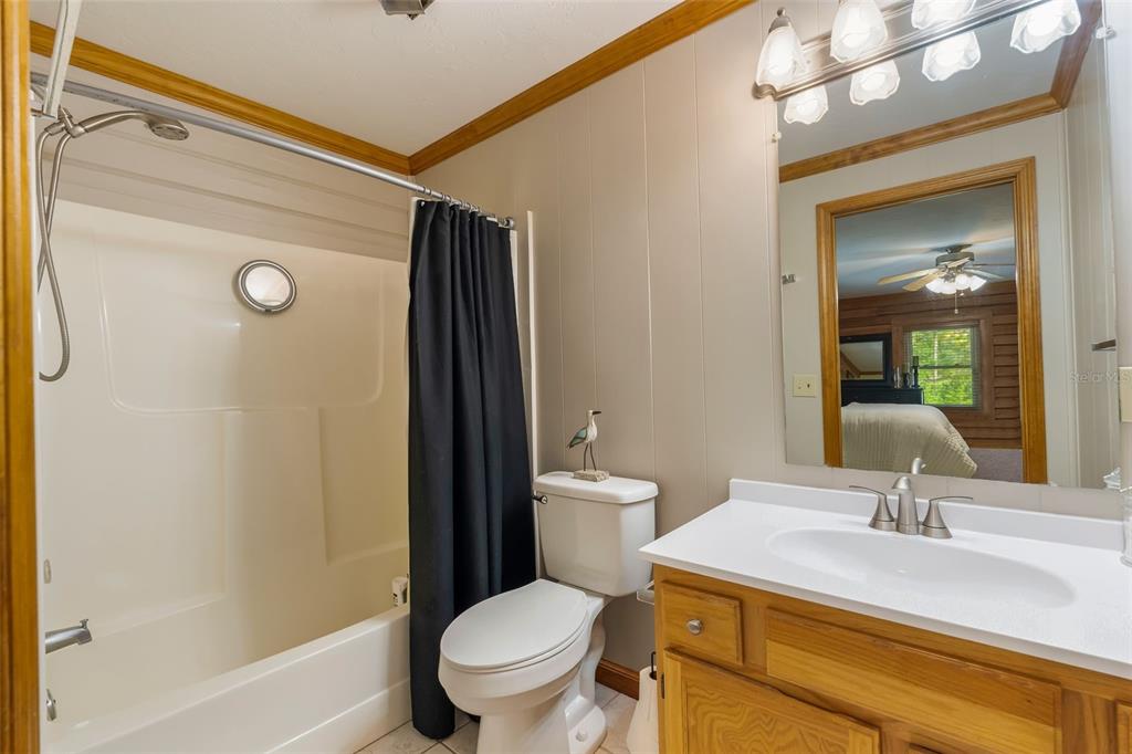 3771 184th Street Wellborn, FL 32094 - Photo 38 of 74 a bathroom with a sink a toilet and shower