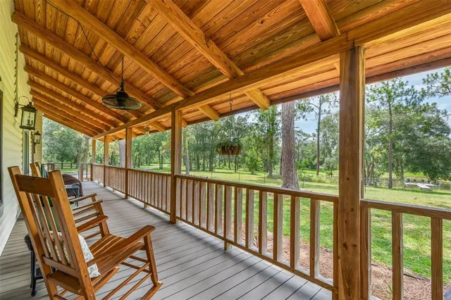 an outdoor space with swimming pool and furniture