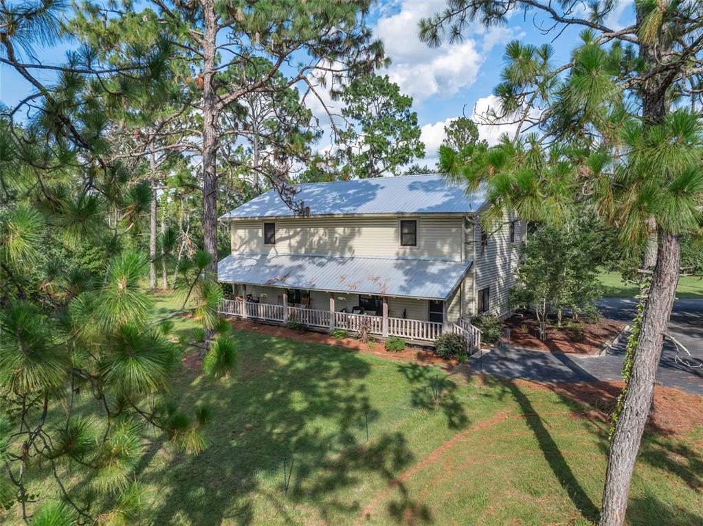 3771 184th Street Wellborn, FL 32094 - Photo 46 of 74 a view of a house with a yard
