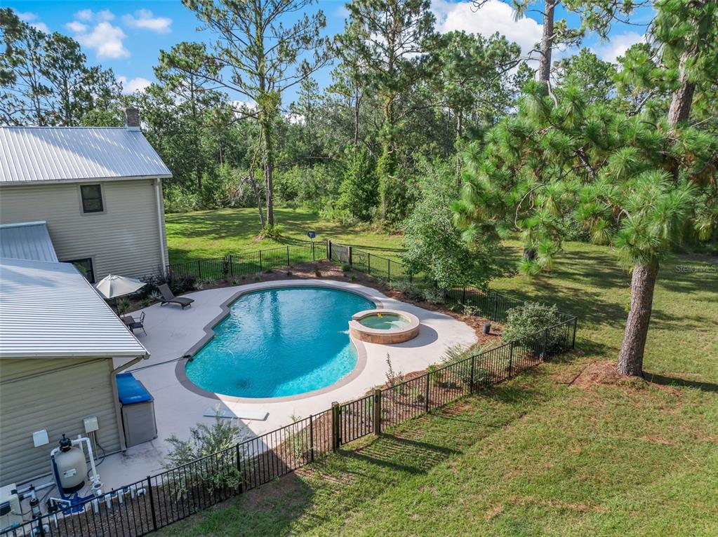 3771 184th Street Wellborn, FL 32094 - Photo 47 of 74 a view of a swimming pool and lounge chair