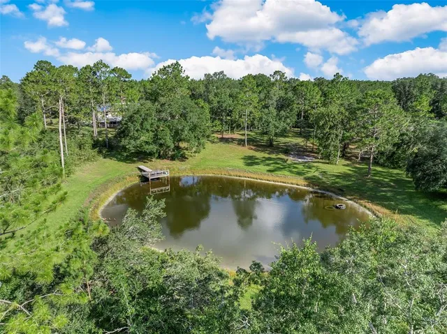 a view of balcony with wooden floor and fence