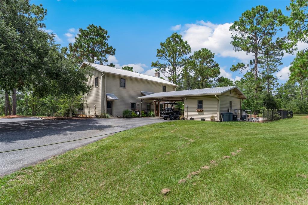 3771 184th Street Wellborn, FL 32094 - Photo 6 of 74 a front view of house with yard and trees