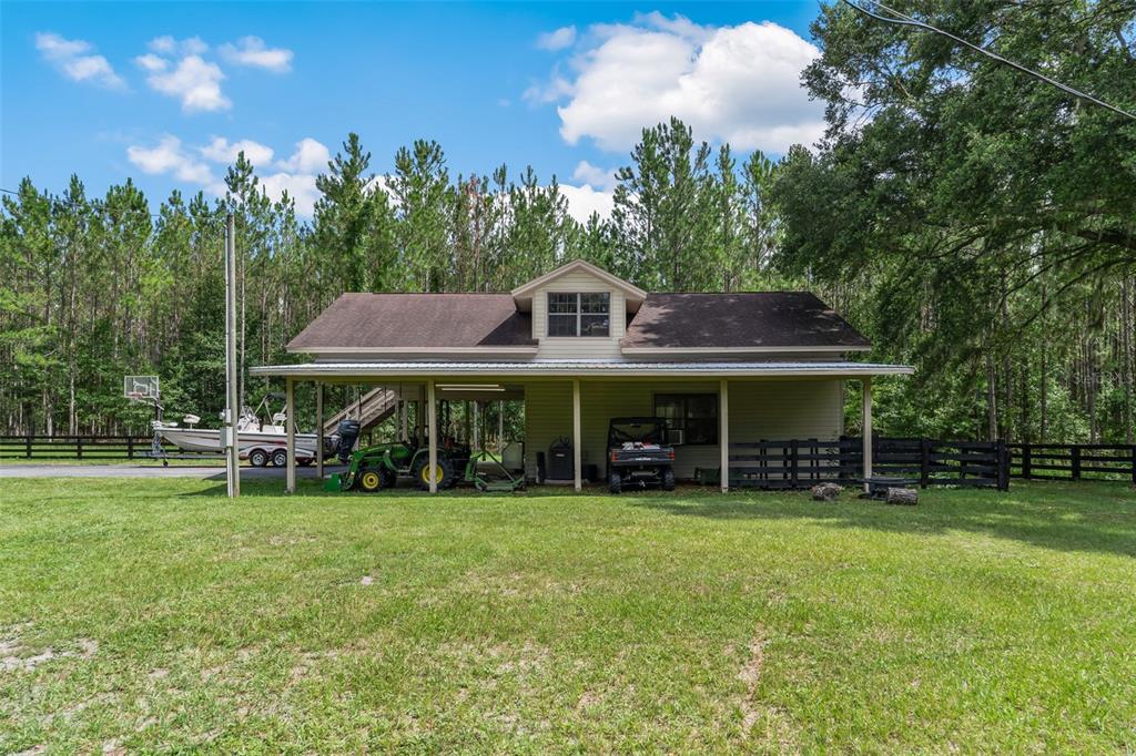 3771 184th Street Wellborn, FL 32094 - Photo 63 of 74 a front view of a house with garden