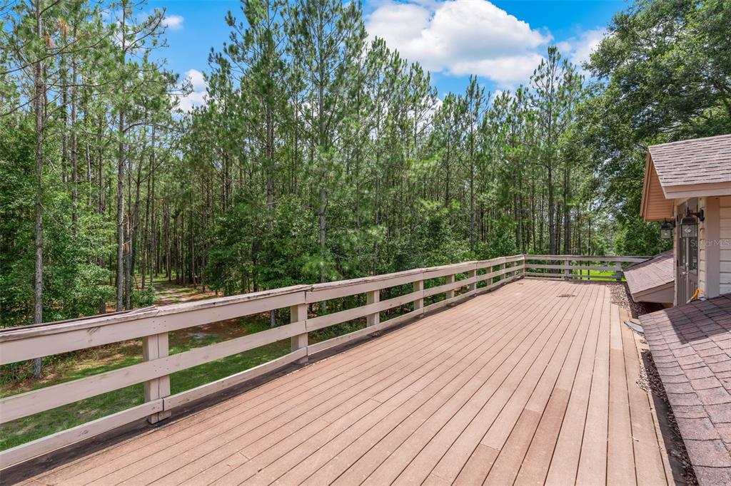 3771 184th Street Wellborn, FL 32094 - Photo 74 of 74 a view of balcony with wooden floor and fence