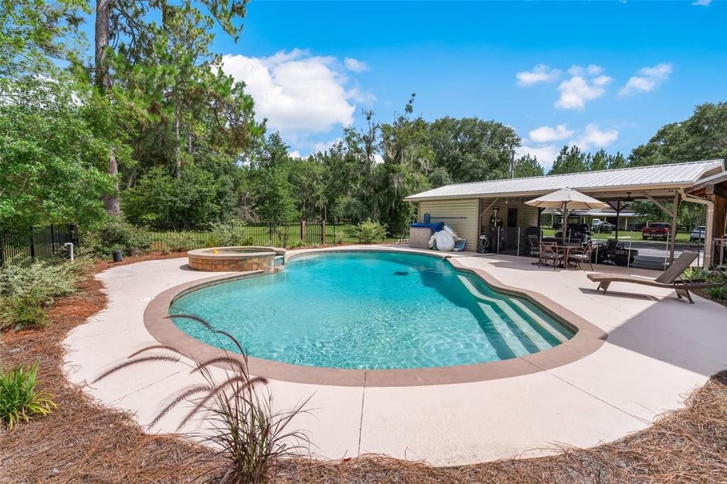3771 184th Street Wellborn, FL 32094 - Photo 8 of 74 an outdoor space with swimming pool and furniture