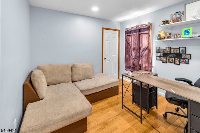 20 Center Street Butler, NJ 07405 - Photo 12 of 17 a living room with furniture and a window