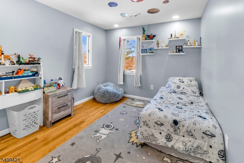 20 Center Street Butler, NJ 07405 - Photo 14 of 17 a bedroom with furniture and a wooden floor