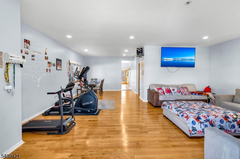 20 Center Street Butler, NJ 07405 - Photo 7 of 17 a room with gym equipment and wooden floor