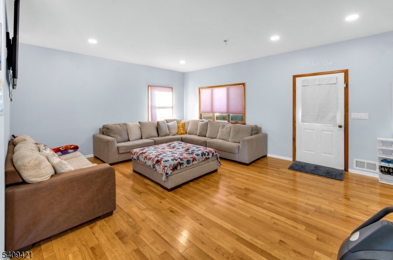20 Center Street Butler, NJ 07405 - Photo 8 of 17 a living room with furniture window and a flat screen tv