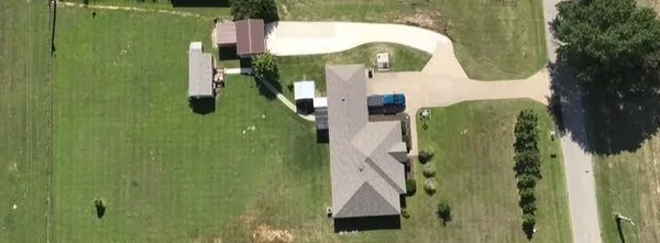 an aerial view of residential house with pool yard and outdoor seating