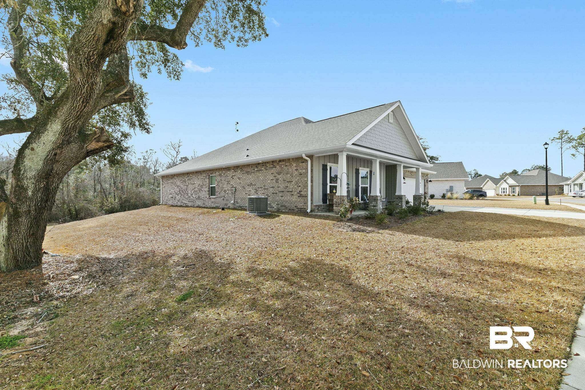1141 Pencarro Boulevard Foley, AL 36535 - Photo 55 of 70 View of side of property featuring covered porch and central air condition unit