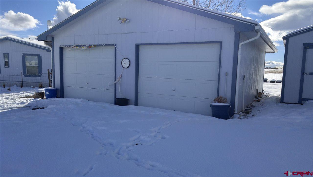 Undisclosed Address Cedaredge, CO 81413 - Photo 12 of 18 This large garage is located to the north of the house.