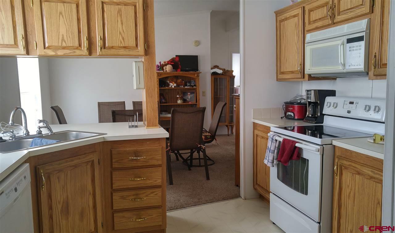 Undisclosed Address Cedaredge, CO 81413 - Photo 4 of 18 Really sweet kitchen with pantry and easy flow. Laundry room/mud room off kitchen.