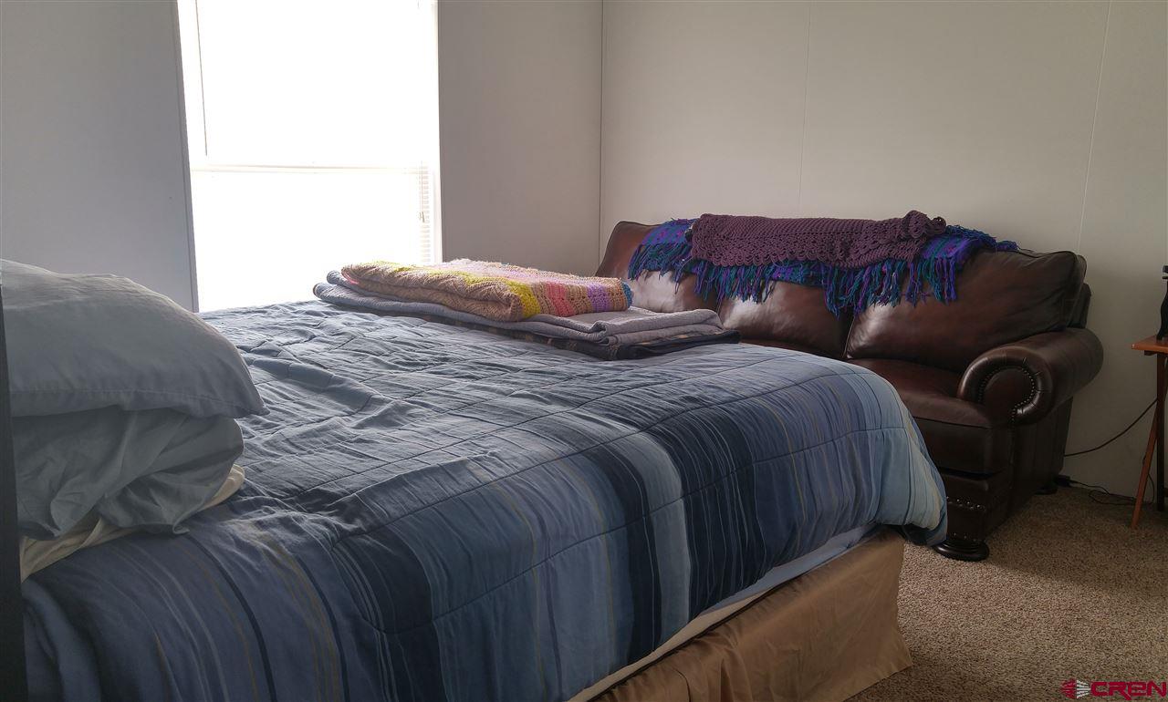 Undisclosed Address Cedaredge, CO 81413 - Photo 8 of 18 Master bedroom has large windows for good light.