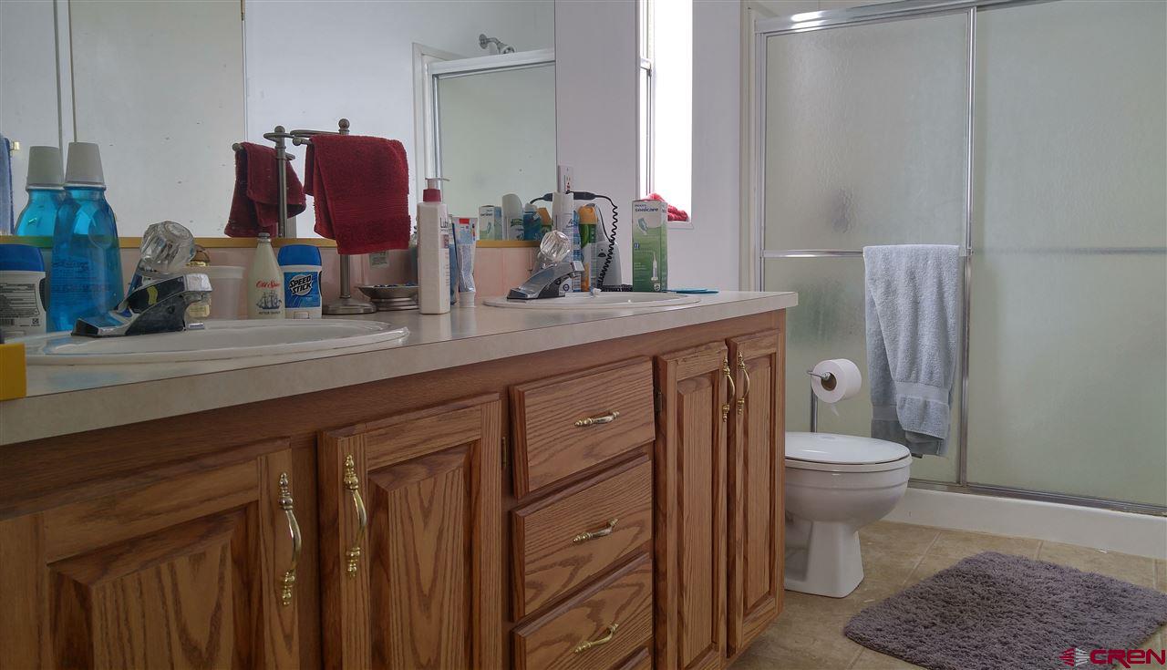 Undisclosed Address Cedaredge, CO 81413 - Photo 9 of 18 This large bathroom has a shower and a linen closet