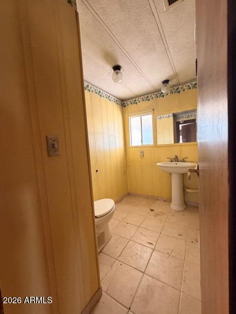 1144 West Edwards Lane Benson, AZ 85602 - Photo 19 of 30 a bathroom with a sink a toilet and mirror