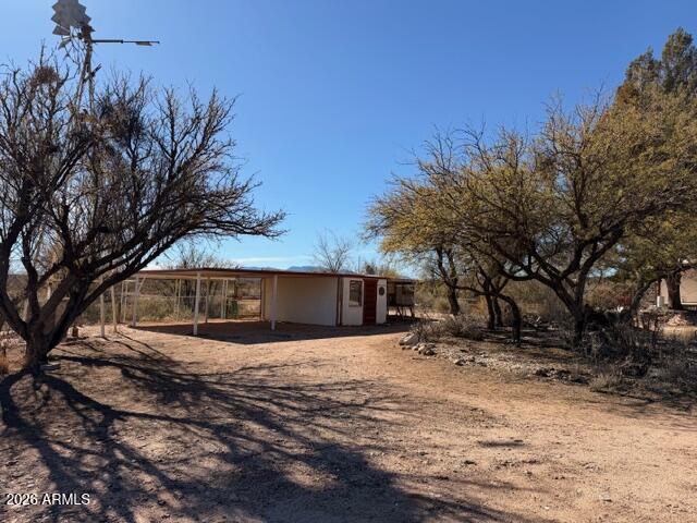 1144 West Edwards Lane Benson, AZ 85602 - Photo 22 of 30 a view of a yard with trees