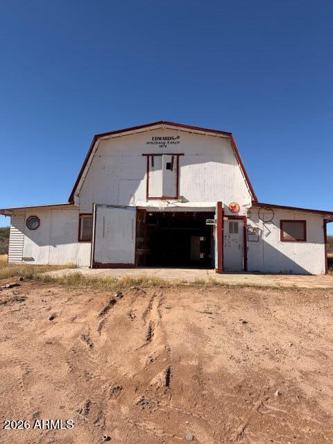 1144 West Edwards Lane Benson, AZ 85602 - Photo 23 of 30 a front view of a house with a yard