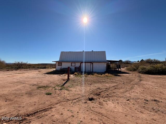 1144 West Edwards Lane Benson, AZ 85602 - Photo 25 of 30 a backyard of a house with table and chairs